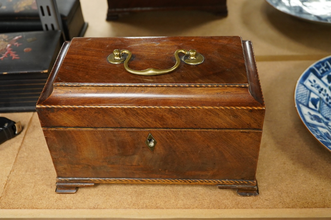 A George III mahogany tea caddy, containing tinned metal canisters, 25cm wide